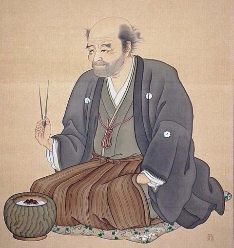 紋付き袴姿で火ばさみを持ち、火鉢の前に座った安居院庄七の肖像画