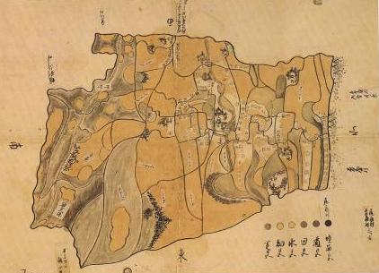区画が分かれ、色分けされた地図の下に凡例が記載されている、今泉村の絵図の写真