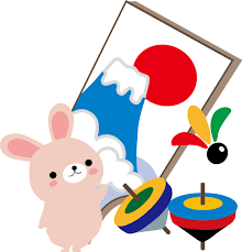 白いウサギのキャラクターが凧とコマの前に立ち、背後に富士山と赤い日の出が描かれた縦長の凧が傾いて配置された新年の伝統的な遊びをテーマにしたイラスト